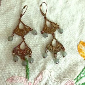 Fan Design Earrings With Green Stones.